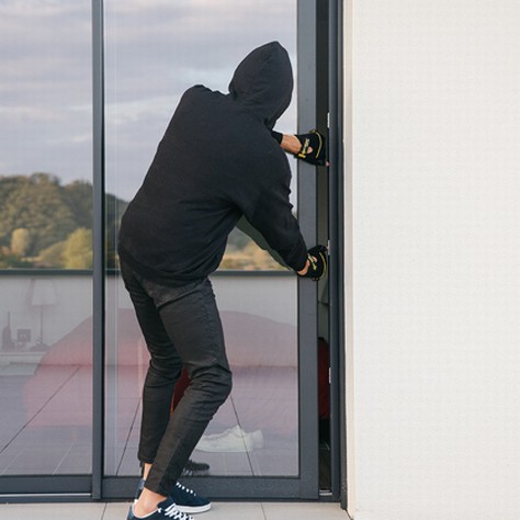 Burglar trying to enter the house
